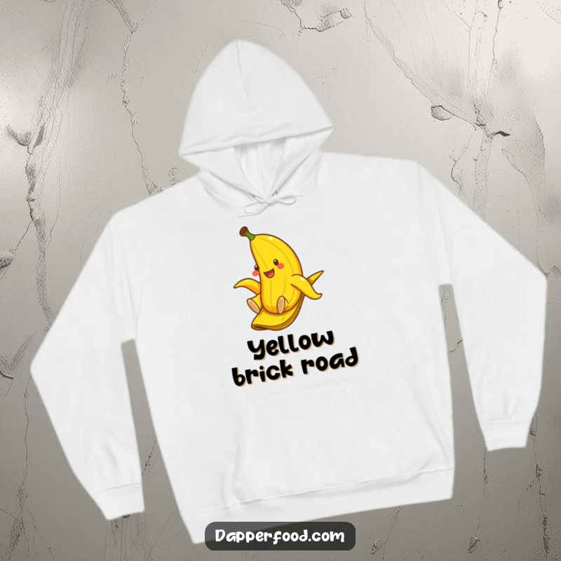 Funny hoodie showing a smiling banana gleefully sliding down a banana peel, offering comfort and lighthearted fun.