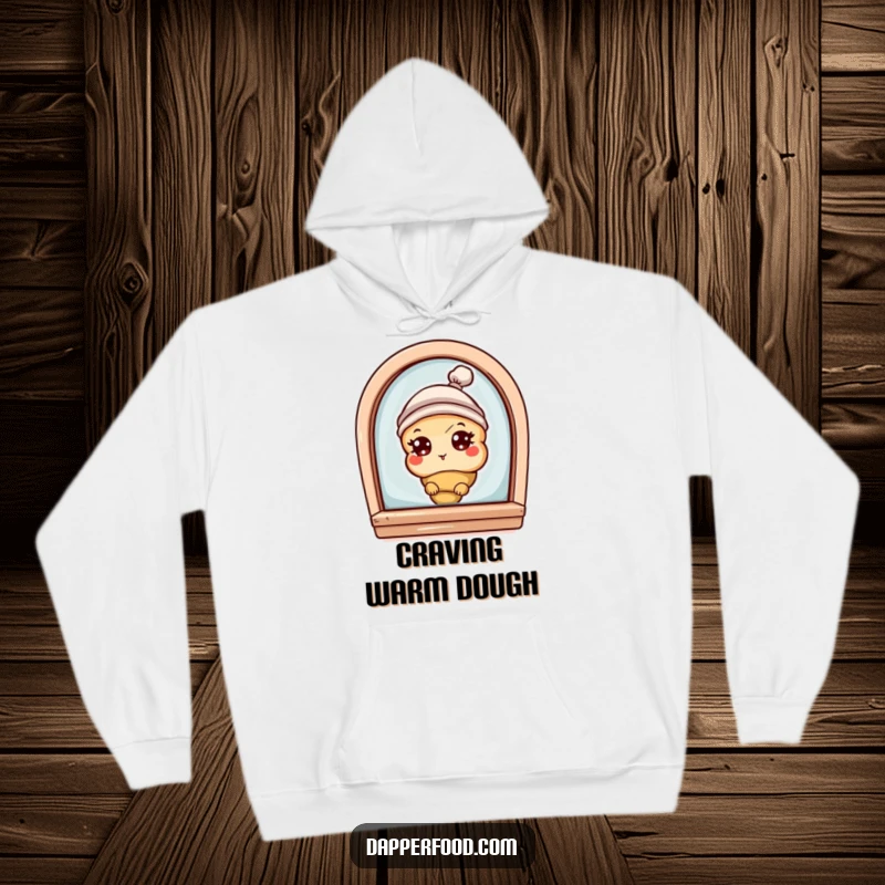 Funny hoodie with a curious croissant character with eyes and a tiny hat, peeking from a bakery window, offering cozy bakery charm.