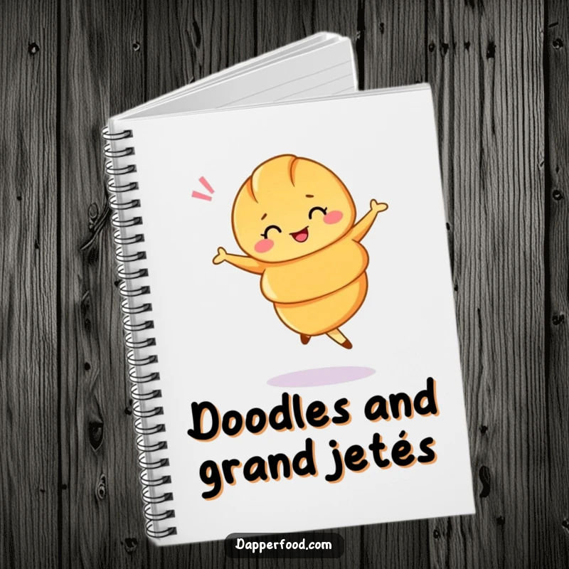 Funny notebook with a croissant performing a ballet twirl and winking, perfect for elegant note-taking.